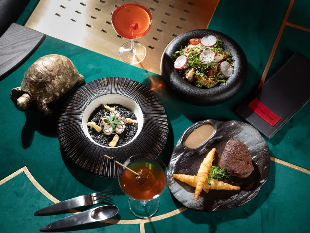 plates with dishes and cocktails