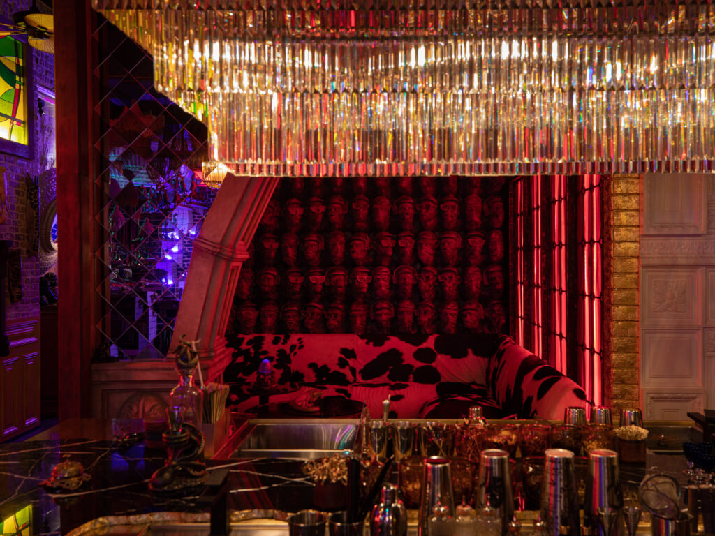 yellow chandelier, red room and bar station